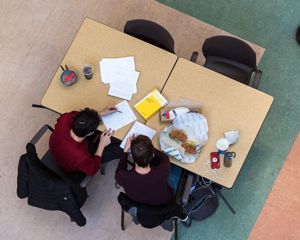 Students walking in front of Free dining hall food choices at University of Rochester